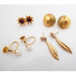 Four pairs of 9-carat gold earrings