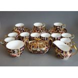 Hand-gilded and painted ceramics in the Imari pattern; to include eleven Royal Crown Derby coffee