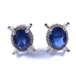 A pair of white-gold, sapphire and diamond earrings