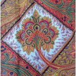 A pair of orange and red paisley-style curtains with deep triple pleat heading (approx. 99cm hem