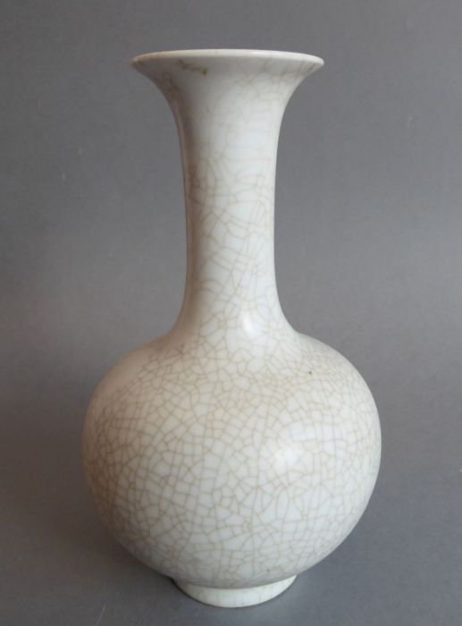 A heavy Chinese porcelain bottle-shaped crackleware vase; inverted rim above a tall slender neck and - Image 2 of 4