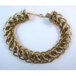 An 18-carat gold fancy open link bracelet, length estimated 17-18cm (gross weight approx. 17.1g)