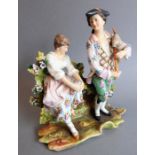 A circa 1850 Volkstadt Rudolstat porcelain figure group; male figure serenading a woman seated