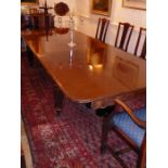 A good and large extending mahogany dining table; late Regency to mid-19th century period, the