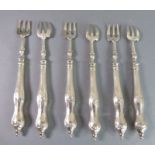 A set of six silver pickle forks