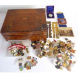 A good quantity of British civilian and military buttons and badges contained within a walnut box