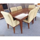 A Baker Furniture 'Cheval' walnut extending dining table with six 'Quebec 69' chairs: the table