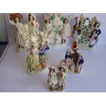 Six 19th century hand-decorated Staffordshire pottery figures to include two double figures modelled