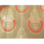 A pair of curtains in a heavy Art Deco-style material with a cord and tassel trim, thermal and