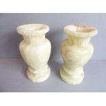 A heavy pair of mid-20th century solid carved banded agate vases of baluster form (22cm high, 10.5cm