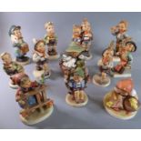 Twelve Hummel/Goebel hand-decorated porcelain figures to include Schoolboy (2), Merry Wanderer,