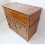 An unusual 19th century Continental stained-pine bread-proving cupboard; the hinged planked chest-