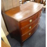 An early 19th century bow-fronted mahogany chest; two half-width over two full-width graduated