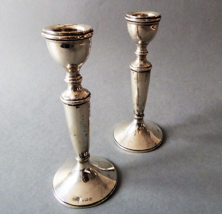 A small pair of silver candlesticks, Birmingham 1916 assay mark