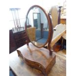 A late 18th / early 19th century mahogany and rosewood crossbanded toilet mirror; serpentine-