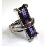 A large and unusual fashion ring (probably silver plated) set with large vertical hand-cut stone