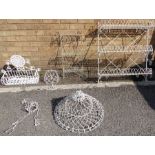 Five pieces of white-painted wirework: three wall-hanging shelves (the largest 76cm wide and the