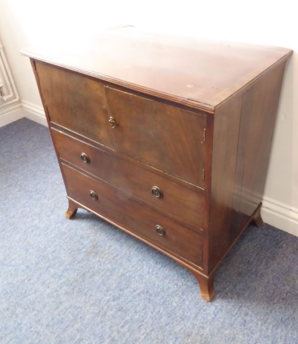 A 19th century (with adaptions) mahogany side cabinet; the reeded edge top above two doors further