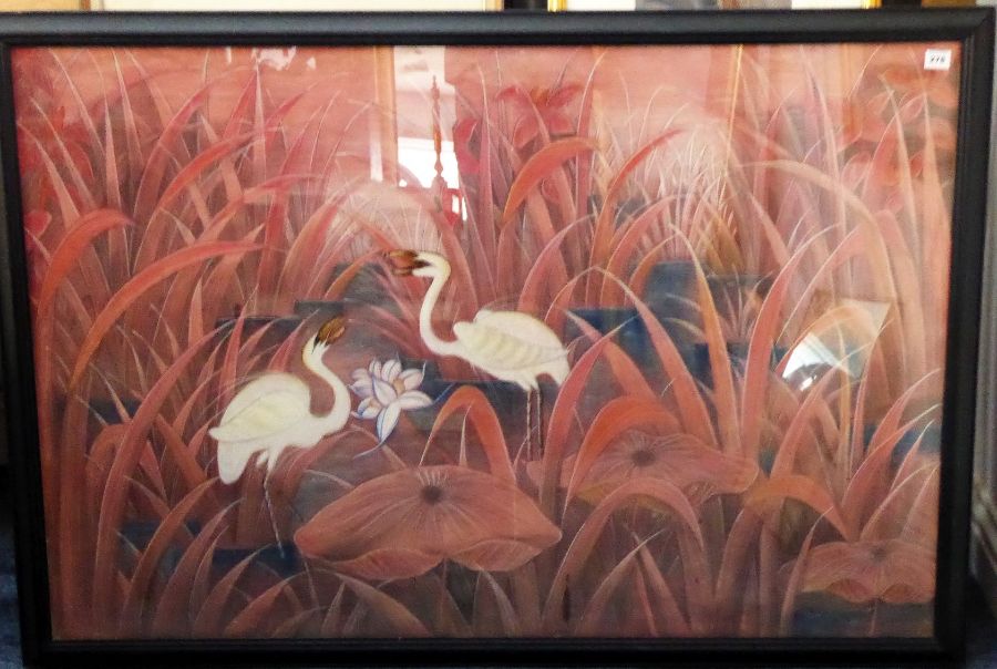 A large ebonised framed and glazed original oil/pastel onto material depicting two egrets amongst