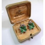 A pair of boxed and ornate silver, green enamel and marquisate clip-on earrings modelled as