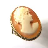 A 9-carat yellow gold dress ring; centrally set with a carved oval cameo in relief (ring size P)