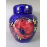 A Moorcroft Pottery jar and cover; tube-lined and hand-decorated with anemones, labelled, painted