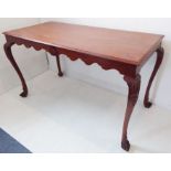 A large 18th-century-style (later) centre library table; wavy edged friezes and raised on four