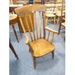 A late 19th century lathe-back open armchair with shaped elm seat