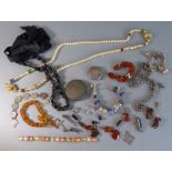 Costume and silver jewellery to include a carved Whitby jet necklace, a silver charm bracelet, a