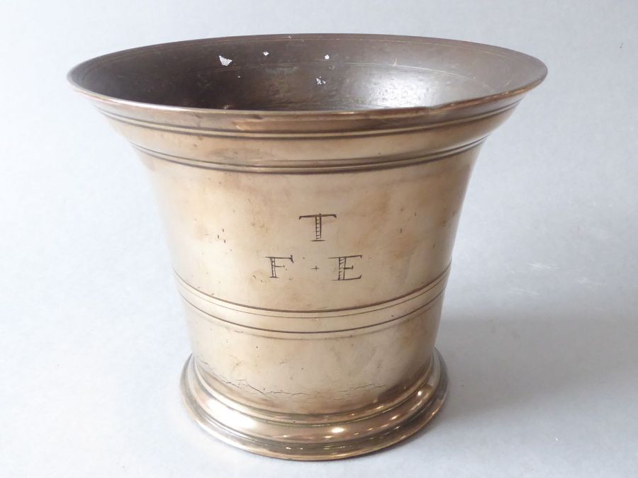 An 18th century bell-metal mortar with original pestle initialled T.F.E. - Image 2 of 5