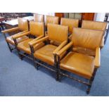 A good harlequin matched set of eight tan-leather-upholstered solid oak open armchairs;  late 19th /