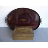 An Edwardian kidney-shaped two-handled mahogany serving tray decorated with a central marquetry