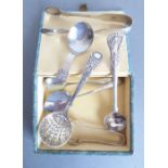An assortment of silverware including an Arts and Crafts-style hallmarked silver caddy spoon