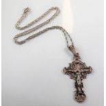 A silver crucifix pendant suspended from a silver chain (boxed)