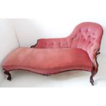 A fine mid-19th century chaise longue; pink velour button-back-upholstered carved walnut, shaped