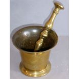 An antique (probably 19th century or earlier) brass pestle and mortar