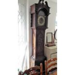 A George III style (later) heavily carved oak eight-day longcase clock; the broken swan-neck