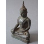 A bronze seated buddha (12.5cm high)