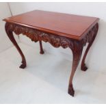 An 18th-century-style teak/hardwood centre table (modern); the thumbnail-moulded top above an