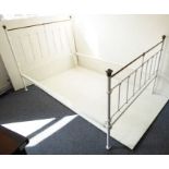 A white-painted and brass double bedstead in Victorian style (the headboard 137cm wide)