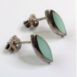 A pair of boxed semi-elliptical silver earrings set with polished blue/green stones