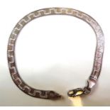 A flat silver bracelet engraved with a Greek key-style design (within red-velvet presentation box)