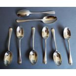 A pair of hallmarked silver Mappin & Webb rat-tail serving spoons, together with an en-suite set