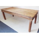 A large and heavy Eastern hardwood farmhouse-style kitchen table; the figured, slightly