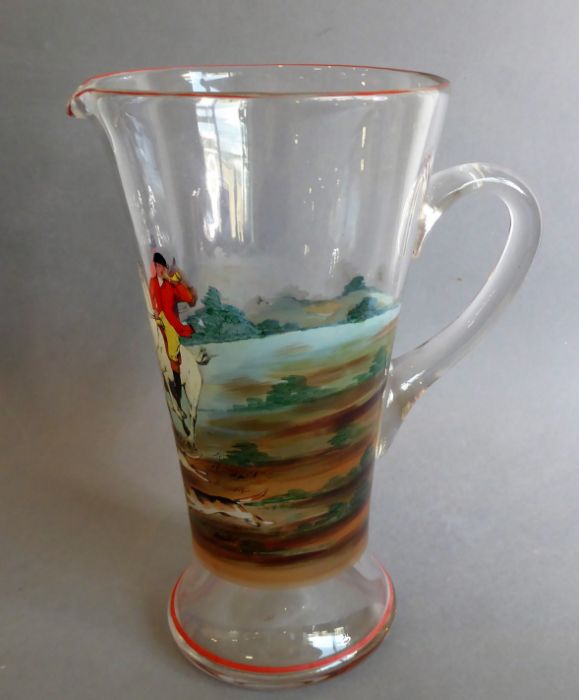 A handmade mid-20th century conical glass jug, hand-decorated with a fox hunting scene (26cm high)