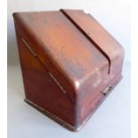 A 19th century mahogany stationery cabinet; the two angular doors opening to reveal letter