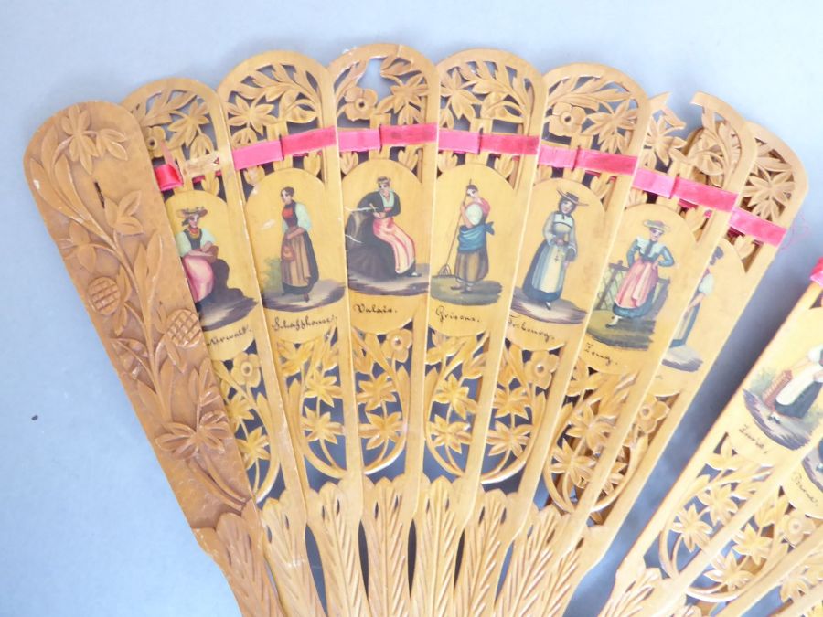 An early 20th century pierced wooden fan decorated with various Swiss costume, together with a - Image 8 of 10