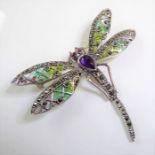 A highly ornate silver, enamel and marcasite stone-set brooch modelled as a dragonfly in high Art