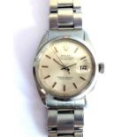 An early 1960s gentleman's steel-cased Rolex Oyster Perpetual Datejust wristwatch; the silver