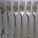 Six 19th century hallmarked silver table forks engraved with armorials. Varying year letters,